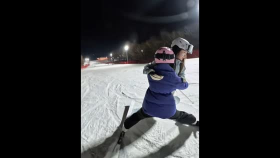 Snowboarder and skier steady each other after close call in Beijing, China