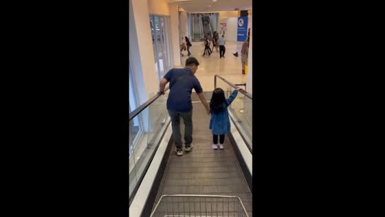 Chill escalator standoff: daughter refuses to be touched by her father