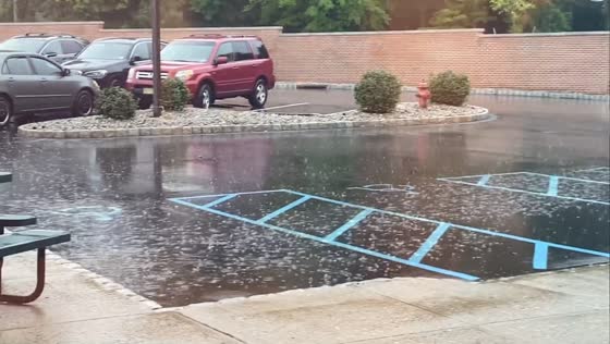 Steady rainfall soaks parking area in Fairfield, New Jersey