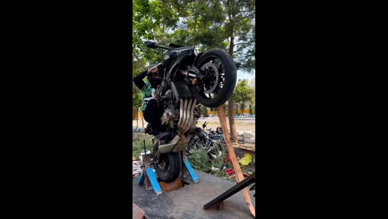 Man practices wheelie on superbike simulator in Hyderabad, India