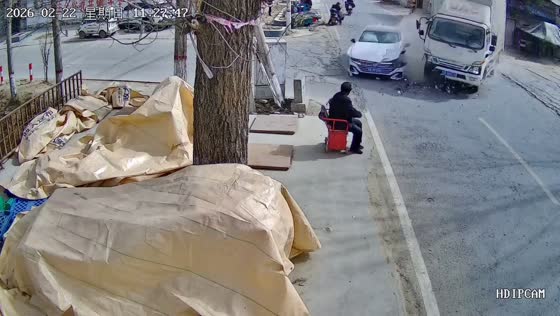Intersection crash between car and truck caught on security camera in Shandong, China