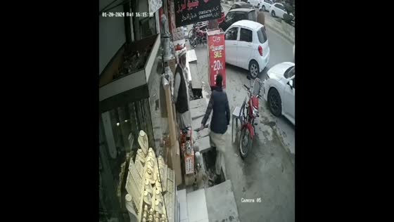 Man trips and falls into street canal in Wah Cantt, Pakistan