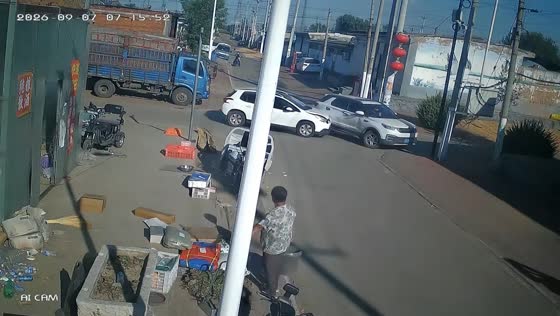 Two white SUVs crash at roadway junction in Hebei, China