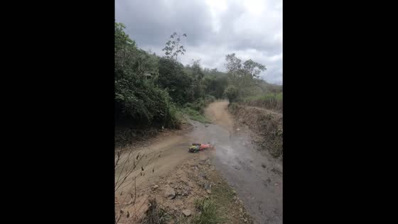 Enduro racer crashes near water stream aftea r veering off course in Balsas, Ecuador