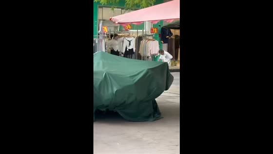 Man performs extreme head-first run into plastic sheet in Hunan, China