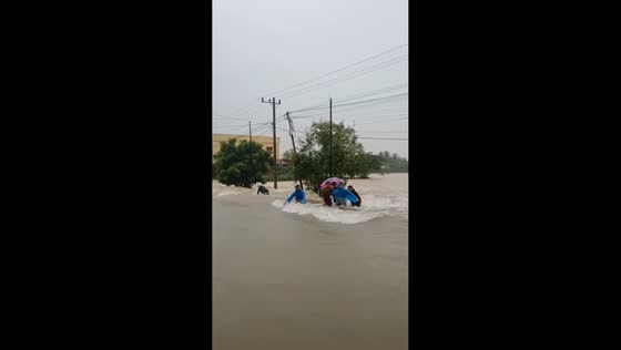 Two residents swept by strong floodwaters in Aceh, Indonesia