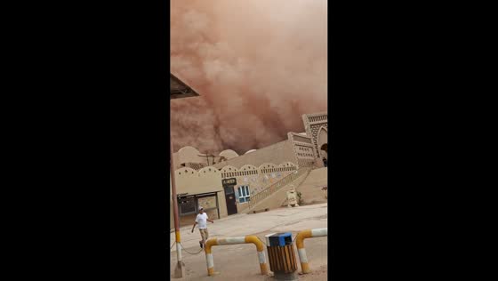 Massive orange sandstorm sweeps Flaming Mountains tourist area in Turpan, Xinjiang, China