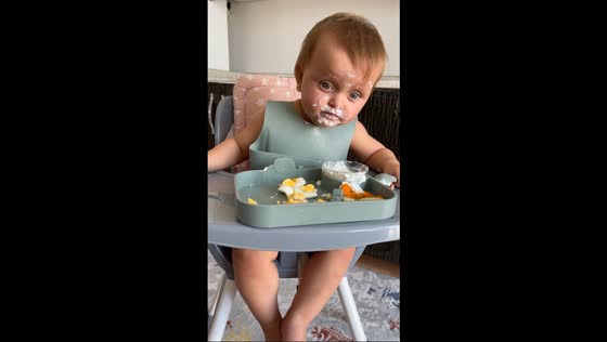 Little girl eats yogurt with her face in the bowl in Yalova, Turkey