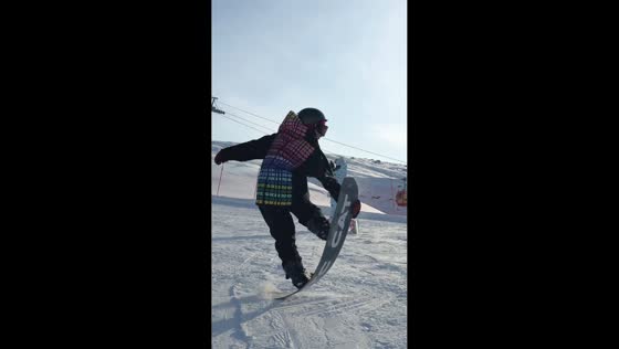 Skiing tricks attempt on ice skateboard in Xinjiang, China