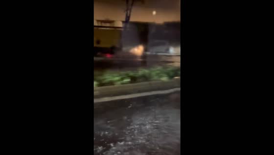 Flash flooding submerges intersection as car drives through rushing floodwater in La Garde, France