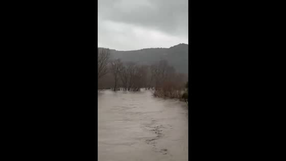 Hérault River bursts banks, flooding fields and roads in Brissac, France