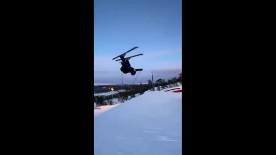 Skier fails backflip attempt and slides down slope in Sälen, Sweden