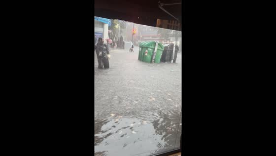 Torrential chaos: Buenos Aires streets submerged as floods carry trash bins adrift