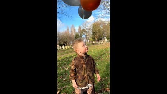 Boy lets pacifier float away with balloons in Middlesbrough, England, UK