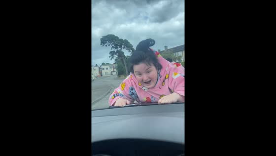 Driver carries person on car hood in South Dublin, Ireland