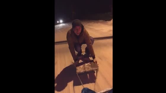 Thrilling Winter adventure takes a tumble: man falls off sled attached to moving car