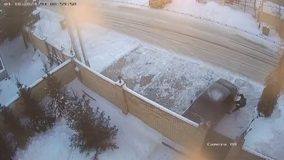 Surveillance video captures Volkswagen accident: elderly man hit while clearing snow