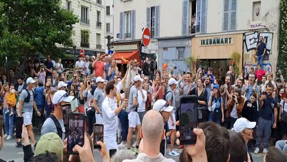 Olympic flame passes through Paris