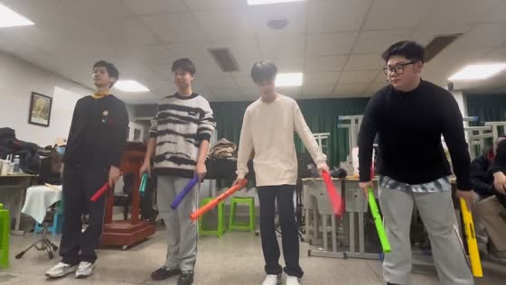 High school students create mesmerizing music with plastic sticks in China