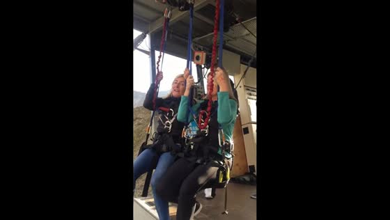 Woman reacts while riding Nevis Swing in Queenstown, New Zealand