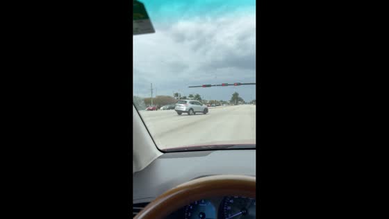White SUV spins uncontrollably at intersection in Miami, Florida, USA