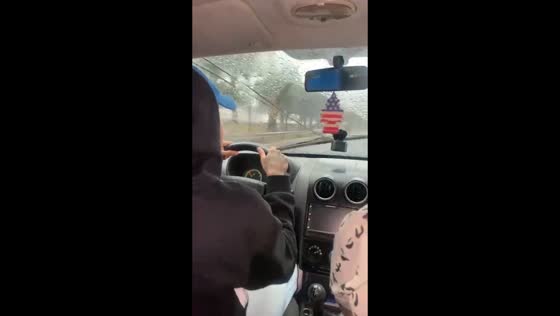 Passengers manually pull broken wiper while driving in São Paulo, Brazil