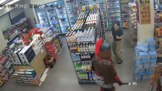 Man in traditional armor surprises store worker in Guangxi, China