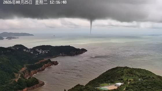 Waterspout stretches from storm clouds to sea in Cangnan, China