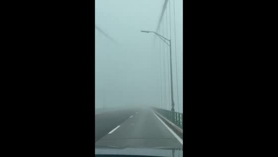 Heavy fog shrouds Mackinac Bridge in Michigan, USA