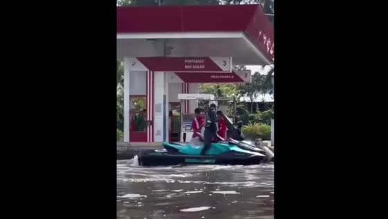 Jet ski refueling in flooded area creates unusual scene in Jakarta, Indonesia
