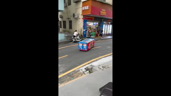 Powerful winds send chest freezer into roadway during Typhoon Noul in Guangdong, China