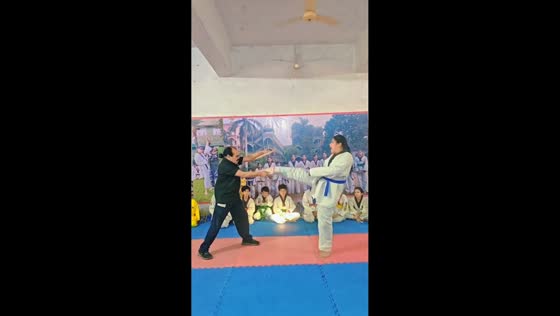 Girl hides pain after breaking tile during taekwondo training in Amroha, India