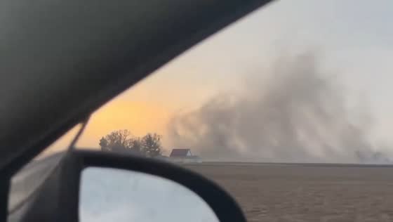 Rare gustnado spins across fields east of Champaign, Illinois, USA