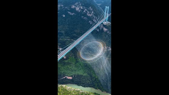 Circular rainbow appears beneath the Huajiang Grand Canyon Bridge in Guizhou, China