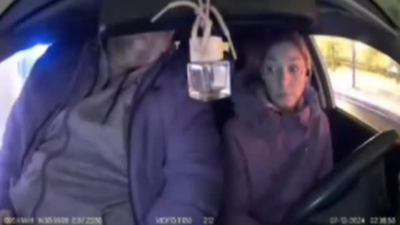Man struggles to fit into taxi in Moscow, Russia