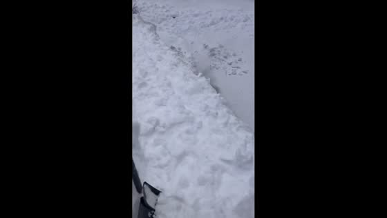 Resident tackles massive rooftop snow after historic snowfall in Aomori, Japan