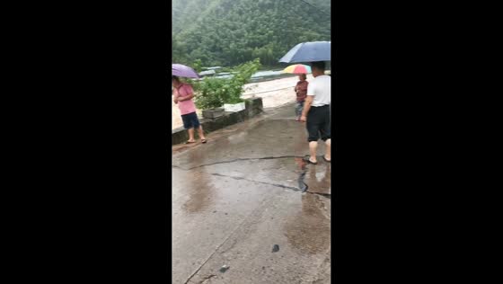 Powerful floodwater rushes through Wangwu in Zhejiang, China
