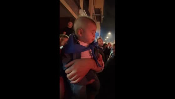 Child reacts fearfully to fireworks in Barcelona, Spain