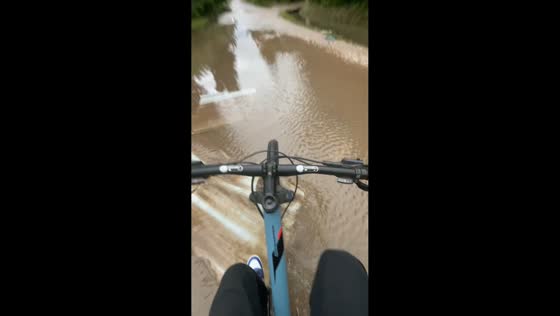 Biking mishap on flooded street in Buenos Aires, Argentina