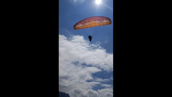 Paraglider takes hard landing while practicing on hillside in Andahuaylas, Peru