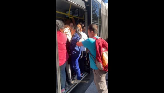 Crowded bus prevents passengers from boarding in Madrid, Spain
