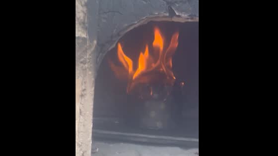 Food catches fire in traditional oven in Lima, Peru