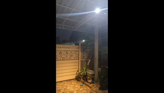 Strong winds and heavy rain hit home terrace in Sidoarjo Taman, Indonesia