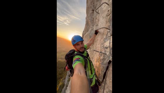 Climber conquers steep mountain face on via Ferrata Sokolov Put, Bosnia & Herzegovina