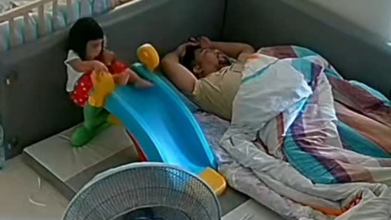 Toddler slips on slide but lands safely on cushion in Bangkok, Thailand