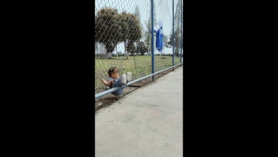 Little girl gets caught by fence after falling backward in Sichuan, China