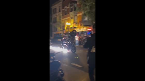 Motorcycle wheelie stunt ends in crash in Chicago, Illinois, USA