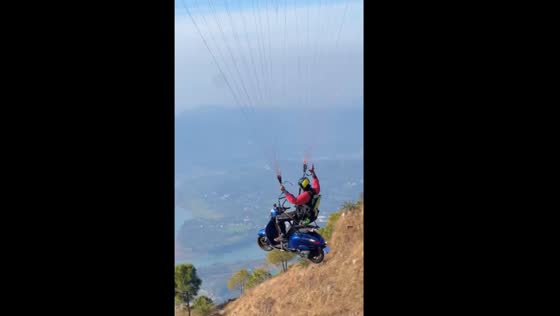 Paragliding with a scooter in India