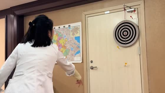 Darts miss the target and hit the door in Jiangsu, China