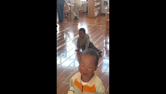 Children cry during kindergarten opening in Guangdong, China